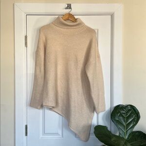 Knit Turtleneck Sweater with Asymmetric Hem